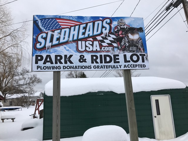 my new park & ride sign behind Sledheads