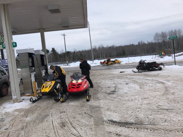 sleds gassing up in Lovells