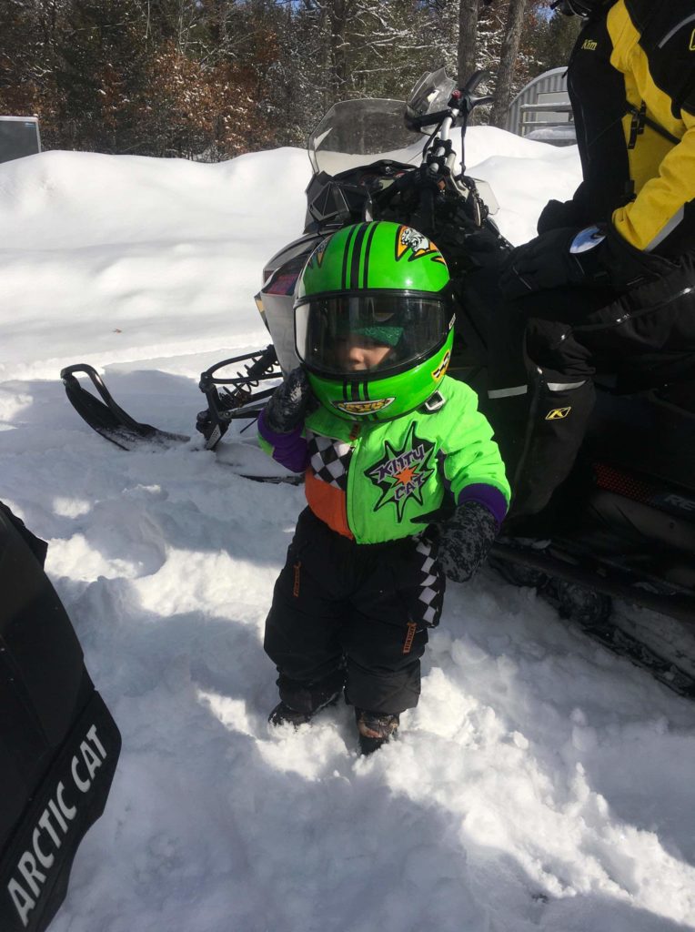 Little Guy sporting his new arctic cat suit he bought at Sledheads, his first ride